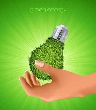 onun elinde çimen ışık. temiz enerji kavramı