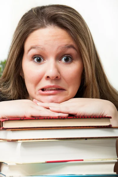 Panicked student with books — Stock Photo, Image