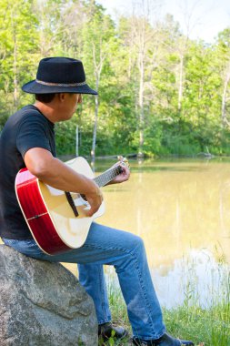 Guitar Player at the Pond clipart