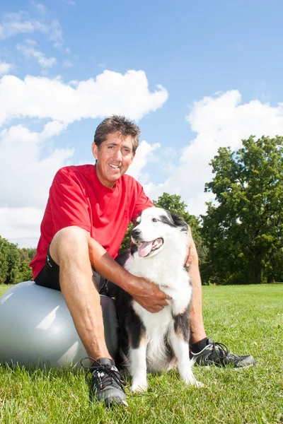 Happy man and his dog — Stock Photo, Image