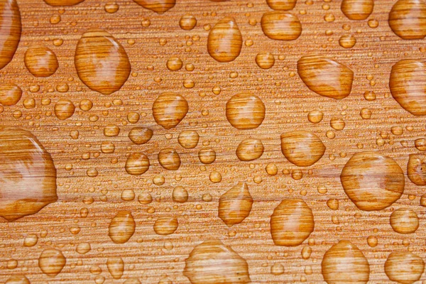 Water beads on decking — Stock Photo, Image