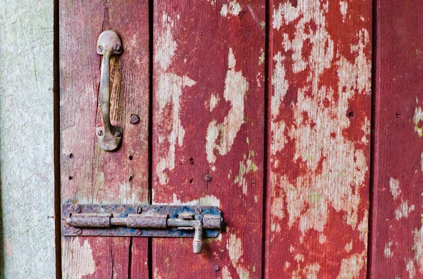 Rusty old door lock on hardwood door — Stock Photo, Image