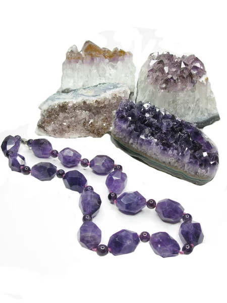 Amethyst geode geological crystals and jewelery beads — Stock Photo, Image