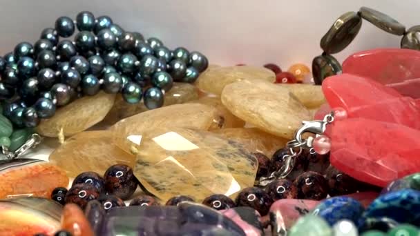 Semigem necklaces and beads jewelery as fashion background — Stock Video