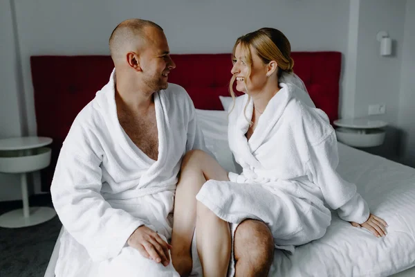 Happy Couple Bathrobes Having Fun Bed Hotel Room High Quality — Stock Photo, Image