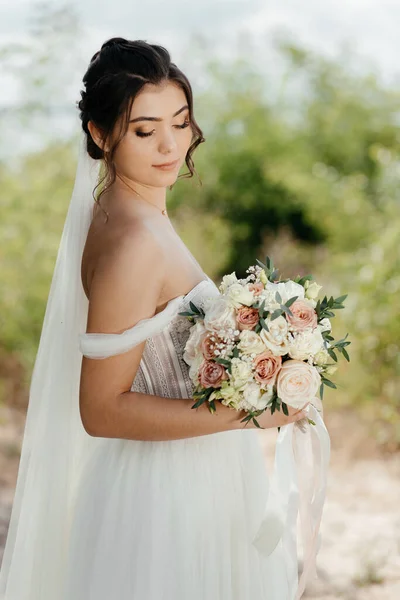 Bride Holds Bouquet Looks High Quality Photo — стоковое фото