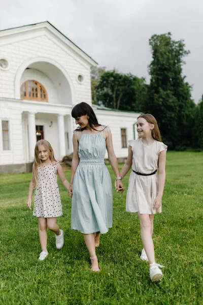 Relaxed Happy Mother Two Little Daughters Outdoors Park Parenthood Child — Stock Photo, Image