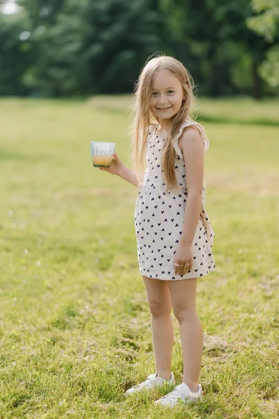 Beautiful Little Girl Outdoors Glass Juice Looking Camera Smiling High — Foto de Stock