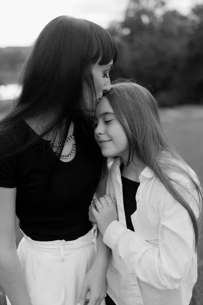Mother Kisses Hugs Her Little Daughter Park Happy Family Concept —  Fotos de Stock