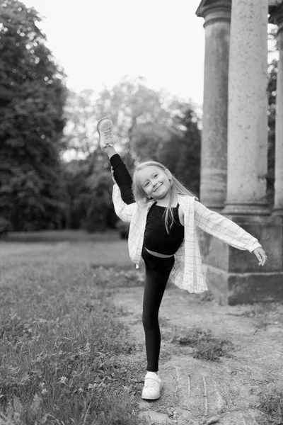 Portrait Girl Gymnast Child Shows Stretching Park Nature Laughs Black — Stok fotoğraf