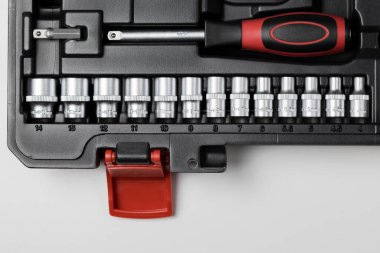 A large set of hexagon sockets in a black box close-up. High quality photo