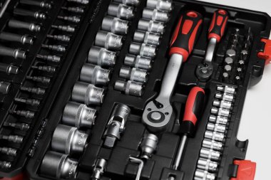 A large set of tools in a black box close-up. Nozzles of different sizes. High quality photo