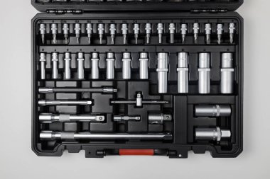  Wrenches of different sizes with different hex heads in a black box on a white table. View from above. High quality photo