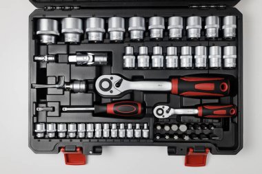  Wrenches of different sizes with different hex heads in a black box on a white table. View from above. High quality photo