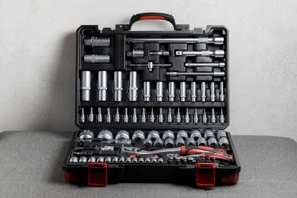  Tool box, details of a set of tools on a gray background. Tools. A set of tools. Car tool kit. Repair tools. High quality photo