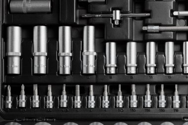 A large set of tools in a black box close-up. High quality photo