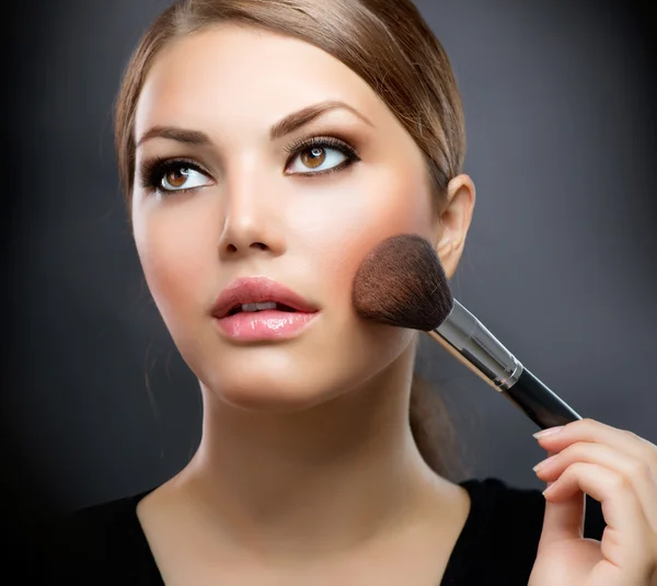 Makeup closeup. Cosmetic Powder Brush. Perfect Skin Stock Photo by