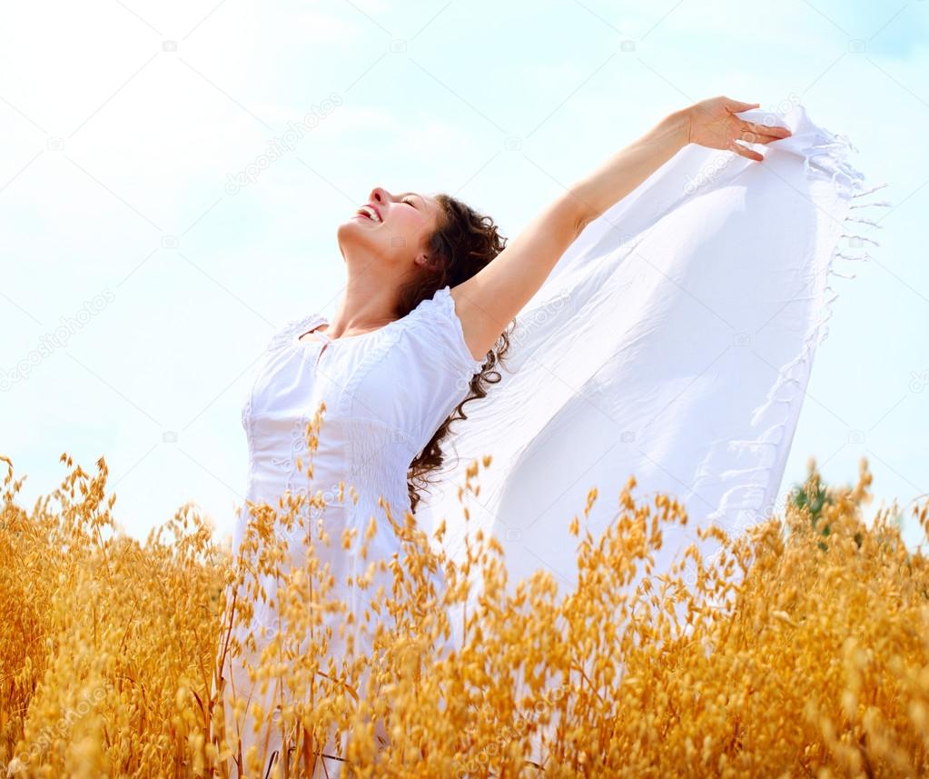 Beautiful Happy Girl Having Fun on the Wheat Field