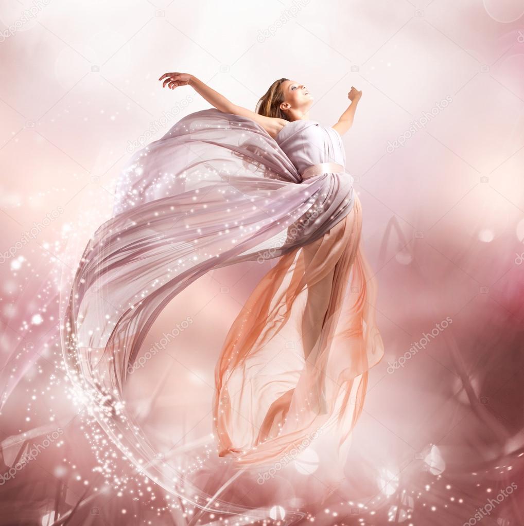 Fairy. Beautiful Girl in Blowing Dress Flying. Magic