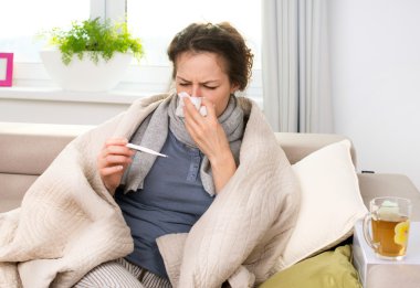 Sick Woman with Thermometer. Flu. Sneezing into Tissue