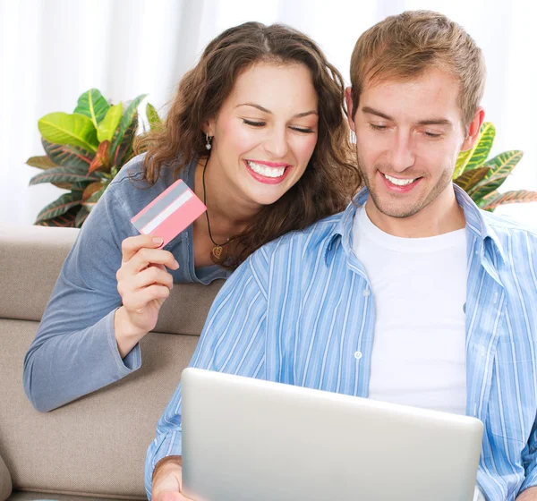 http://st.depositphotos.com/1491329/1627/i/450/depositphotos_16276203-Young-couple-with-Laptop-and-Credit-Card-buying-online.jpg