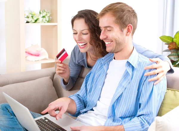 http://st.depositphotos.com/1491329/1627/i/450/depositphotos_16276219-Young-couple-with-Laptop-and-Credit-Card-buying-online.jpg