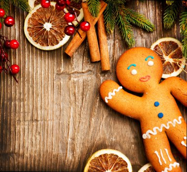 Christmas Holiday Background. Gingerbread Man over Wood