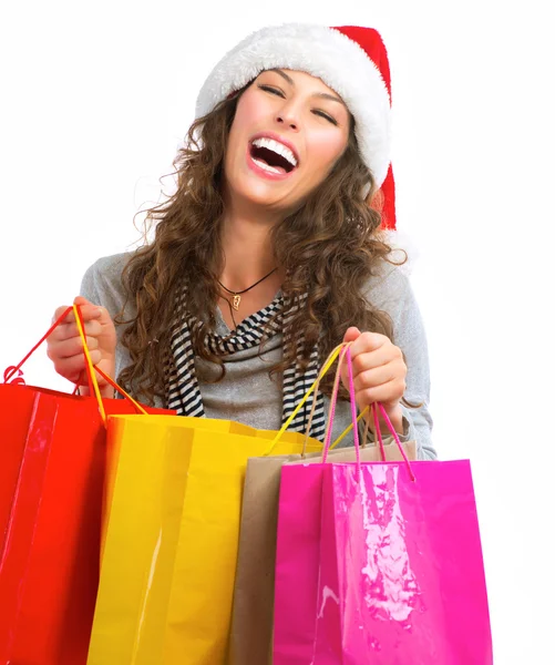 Het winkelen van Kerstmis. vrouw met zakken over wit. verkoop Stockafbeelding