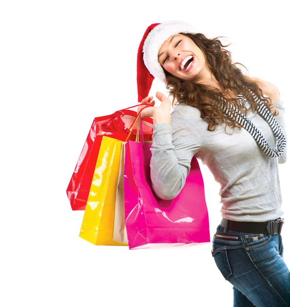 Het winkelen van Kerstmis. vrouw met zakken over wit. verkoop Stockfoto