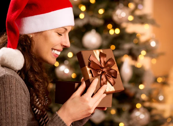 Christmas. Happy Surprised Woman opening Gift box Royalty Free Stock Images