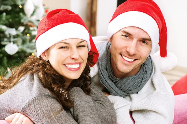 Christmas Couple wearing Santa's Hat Stock Photo
