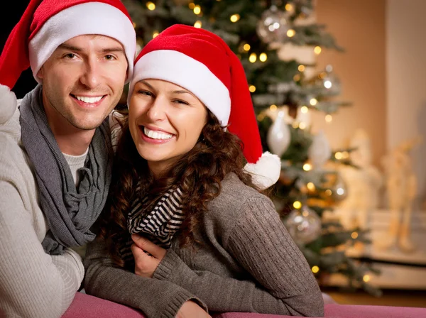 Christmas. Happy Couple at home celebrating Christmas Stock Photo