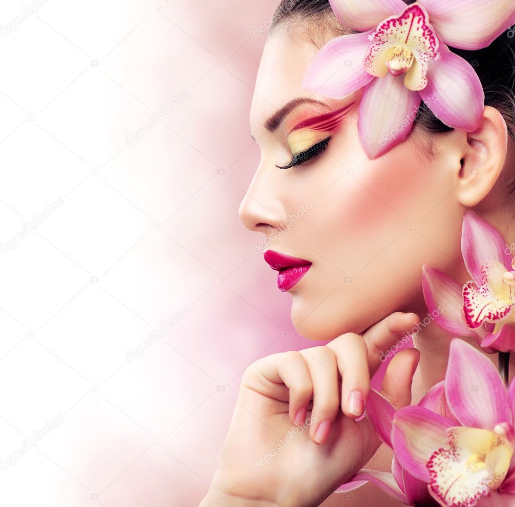 Beautiful Girl With Orchid Flowers. Perfect Makeup