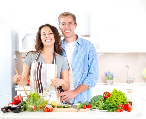 Happy Couple Cooking Together. Dieting. Healthy Food Stock Photo