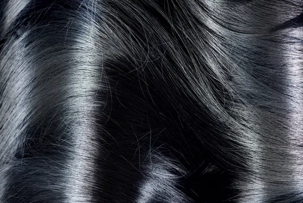 Fondo de pelo negro. Textura de pelo largo oscuro — Foto de Stock