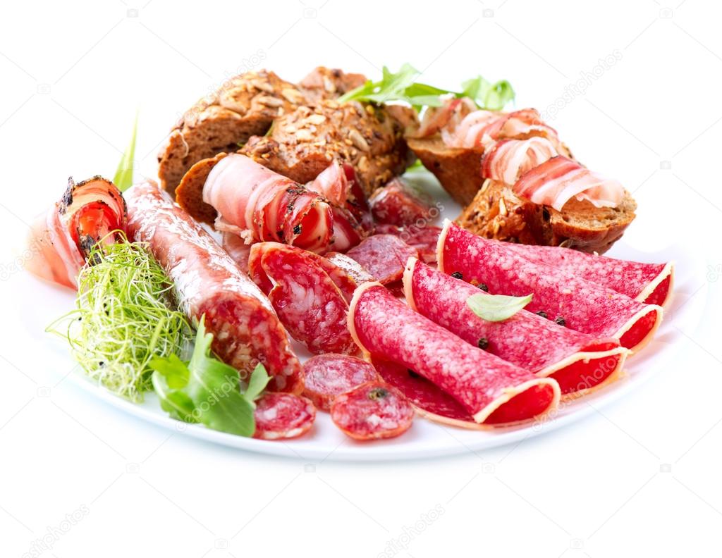 Sausage. Various Italian Ham, Salami and Bacon isolated on White