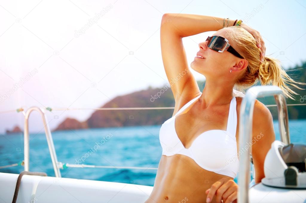 Beautiful Girl resting on the Yacht. Yachting. Luxury Lifestyle