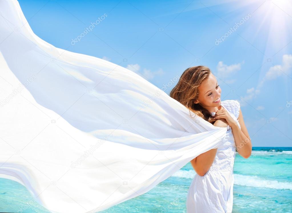 Beautiful Girl With White Scarf on The Beach