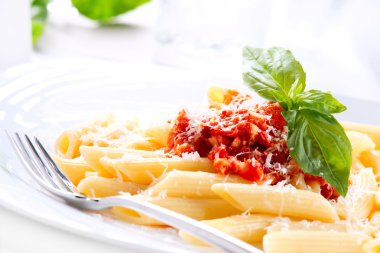 Pasta Penne with Bolognese Sauce, Basil and Parmesan