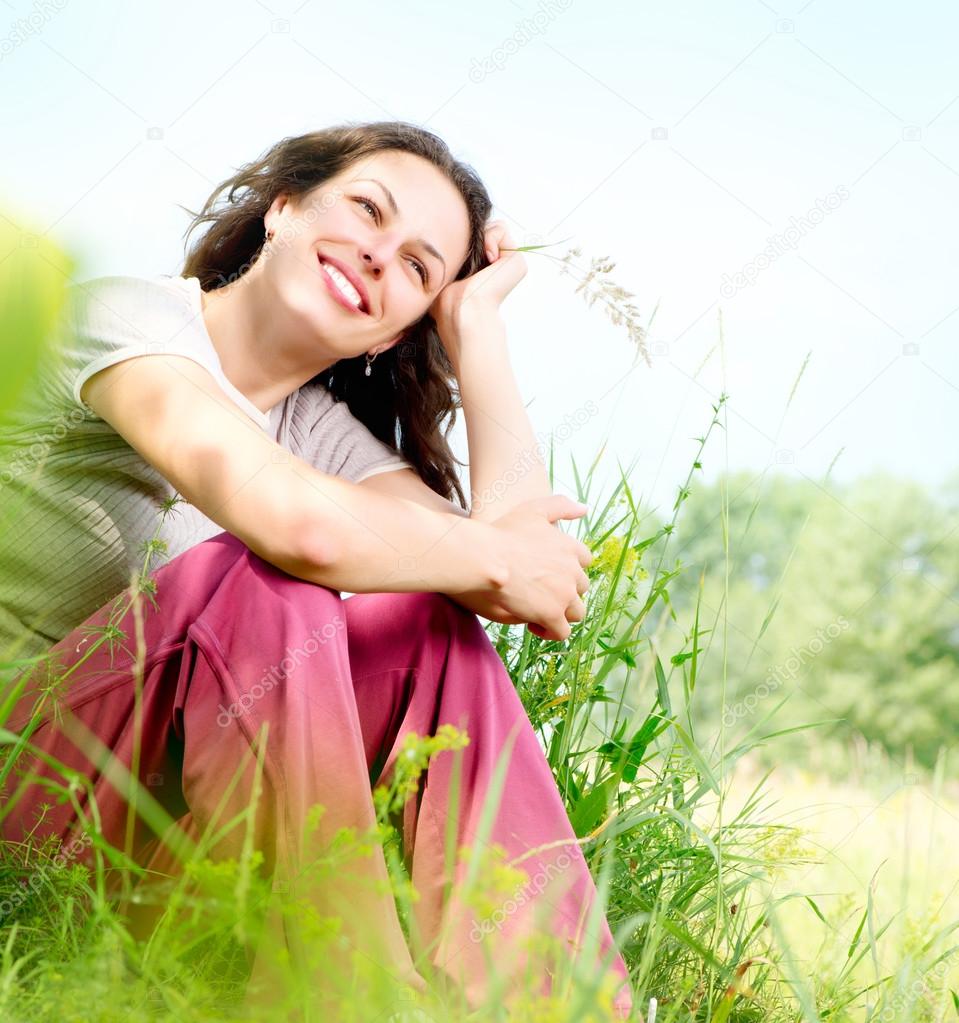 Beautiful Young Woman Outdoors. Enjoy Nature. Meadow
