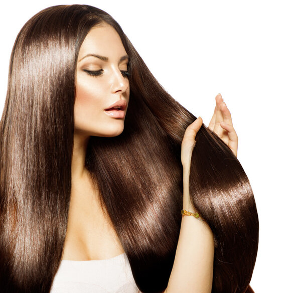 Beauty Woman touching her Long and Healthy Brown Hair