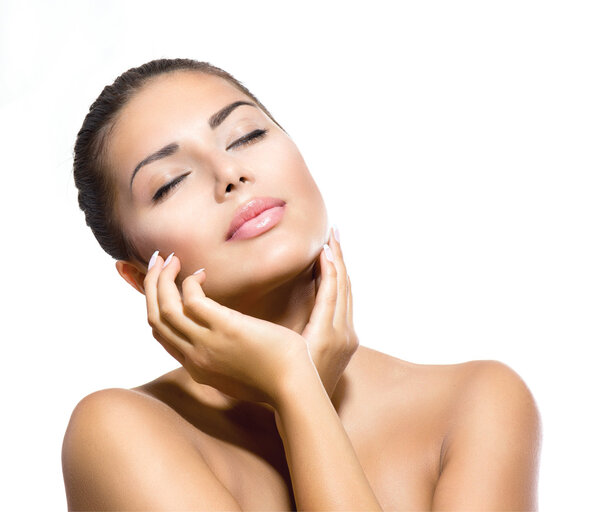 Beauty Portrait. Beautiful Spa Woman Touching her Face