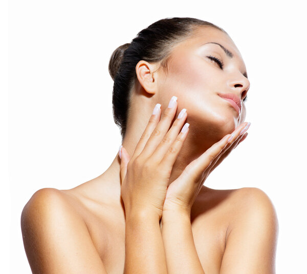 Beauty Portrait. Beautiful Spa Woman Touching her Face