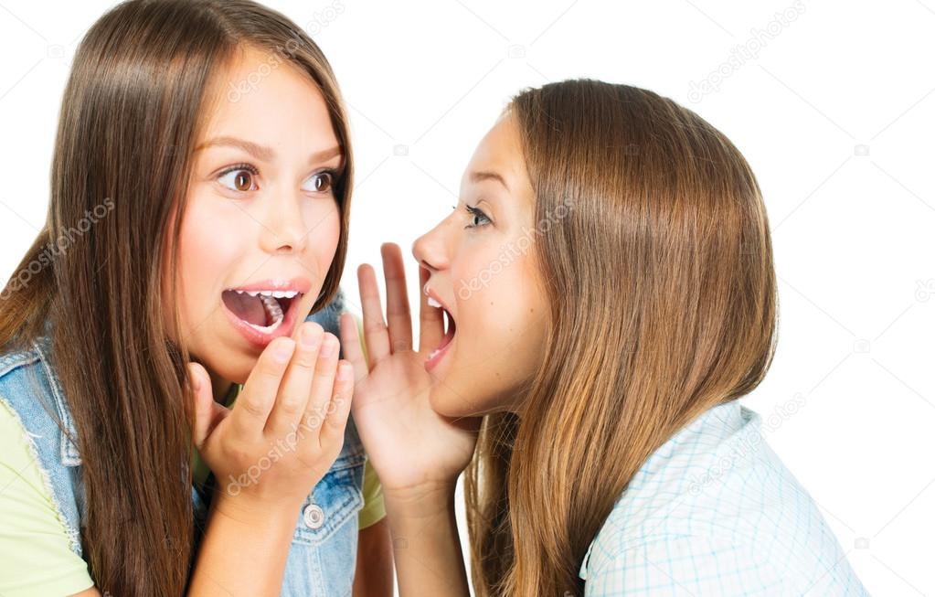 Gossip. Two Teenage Girls Speaking and Sharing Secrets