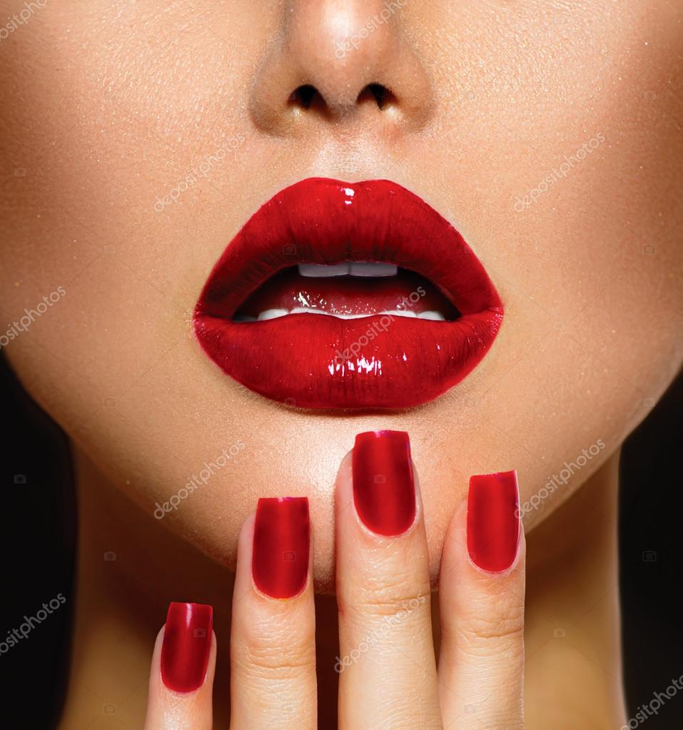 Red Sexy Lips and Nails closeup. Manicure and Makeup Stock Photo by
