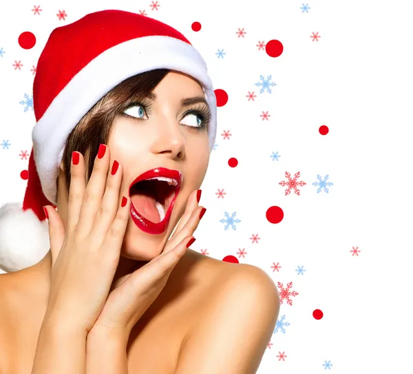 Jul kvinna. skönhet modell flicka i santa hatt över vita — Stockfoto