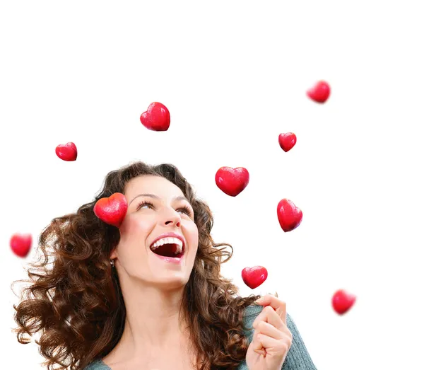 Beauty Young Woman Catching Valentine Hearts (en inglés). Concepto de amor —  Fotos de Stock