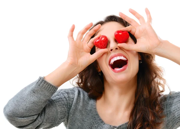 Lustiges fröhliches Mädchen mit Valentinsherzen über den Augen — Stockfoto