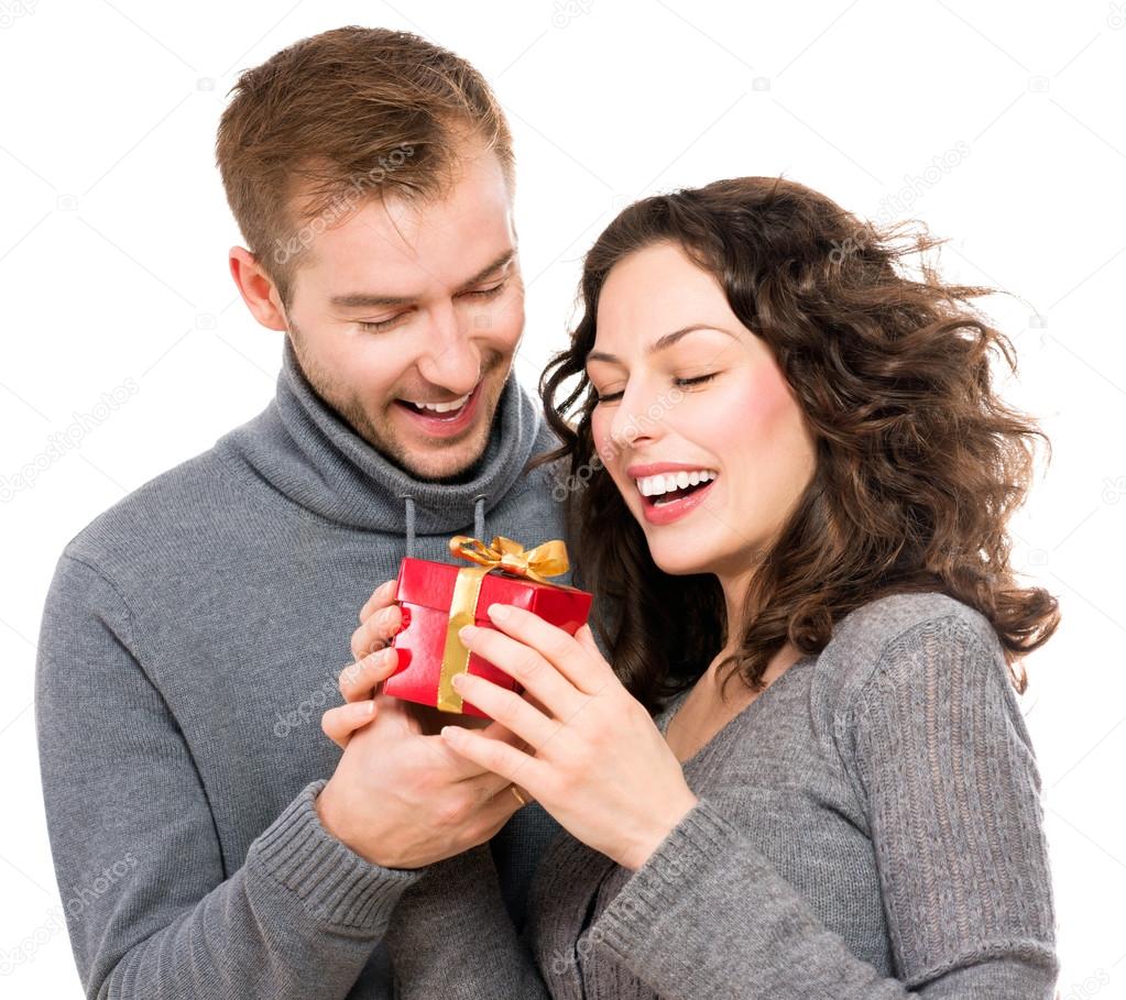 Valentine Gift. Happy Young Couple with Valentine's Day Present