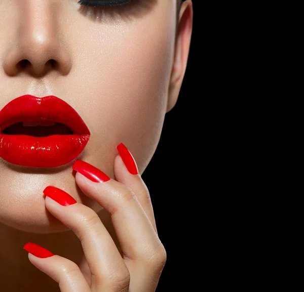 Red Sexy Lips and Nails closeup. Manicure and Makeup Stock Photo